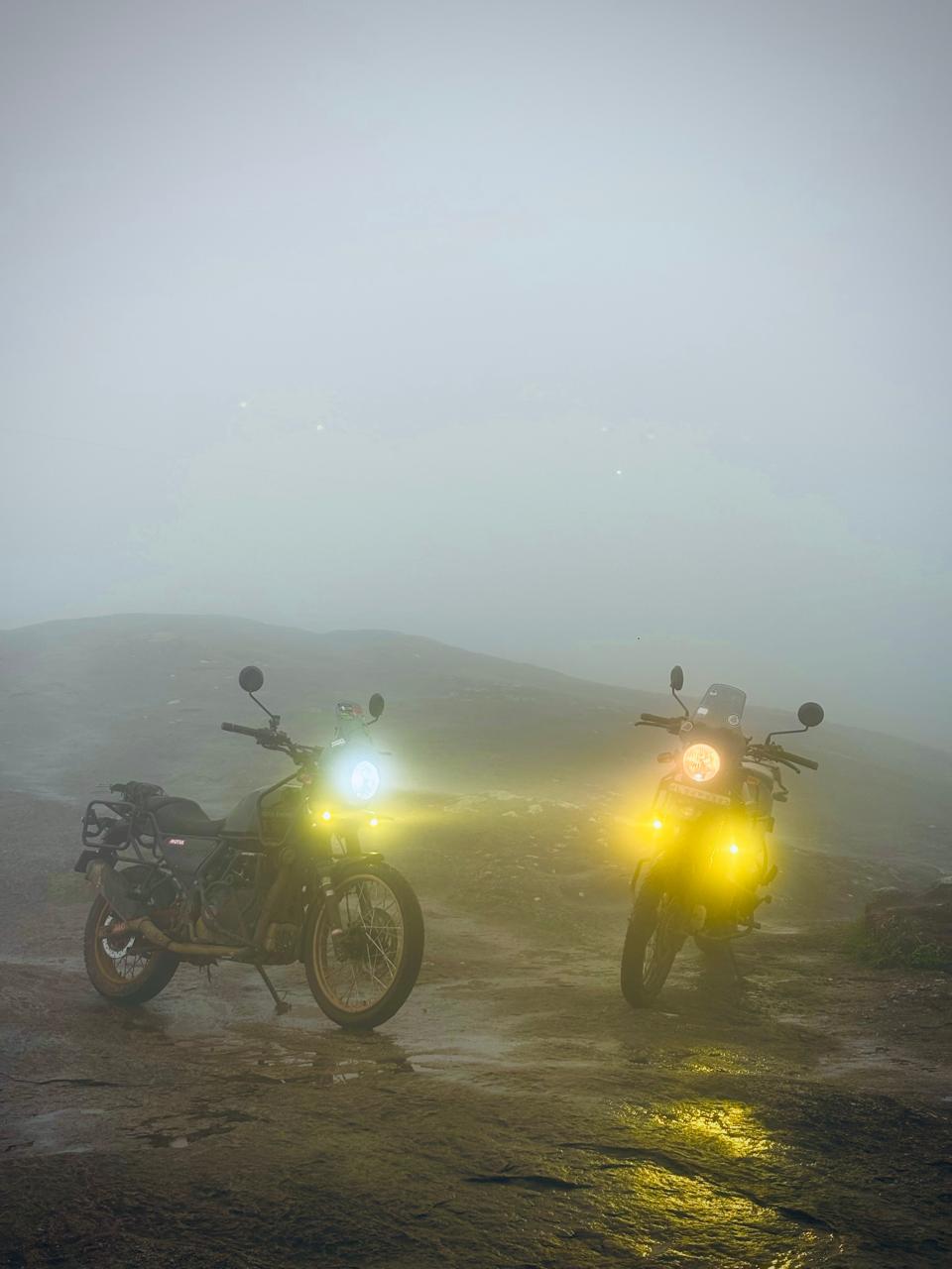Adventure motorcycles in the misty off-road hills near Urumbikkara, Kerala